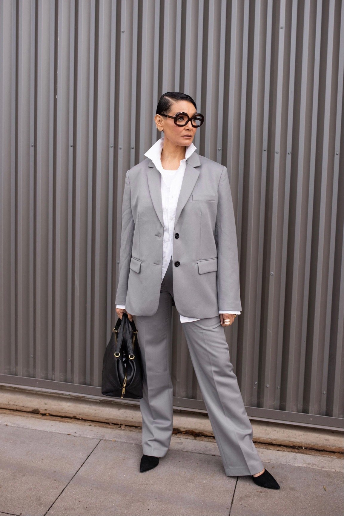 Matching grey suit is from Anine Bing! I have a classic white button down shirt from JCREW open with a white tank top  from Citizens of Humanity layered underneath. I’ve accessories with a pair of black pump heels originally from JCREW, and statement oversized glasses from Vint & York!

#LTKstyletip #LTKsalealert #LTKworkwear