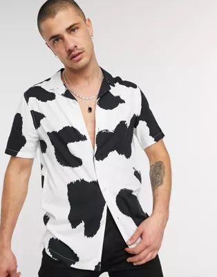 ASOS DESIGN relaxed fit shirt in large scale cow print | ASOS (Global)