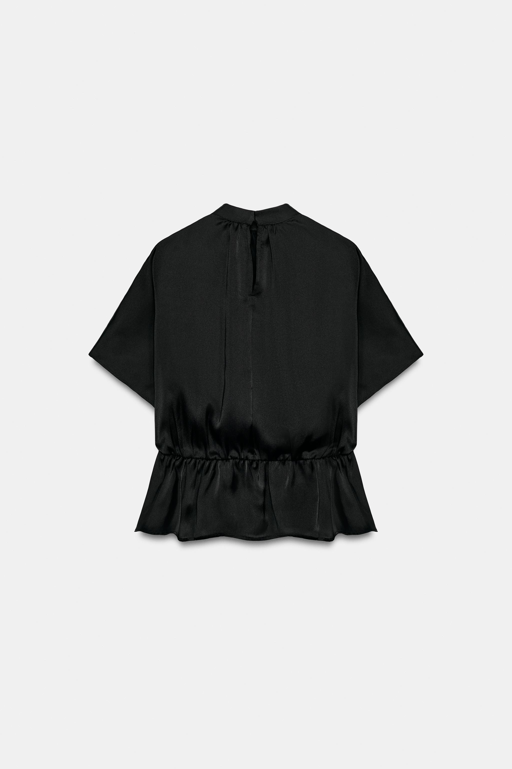 Satin blouse featuring a high neck and wide short sleeves. Hem with gathered detail and elastic. ... | Zara US
