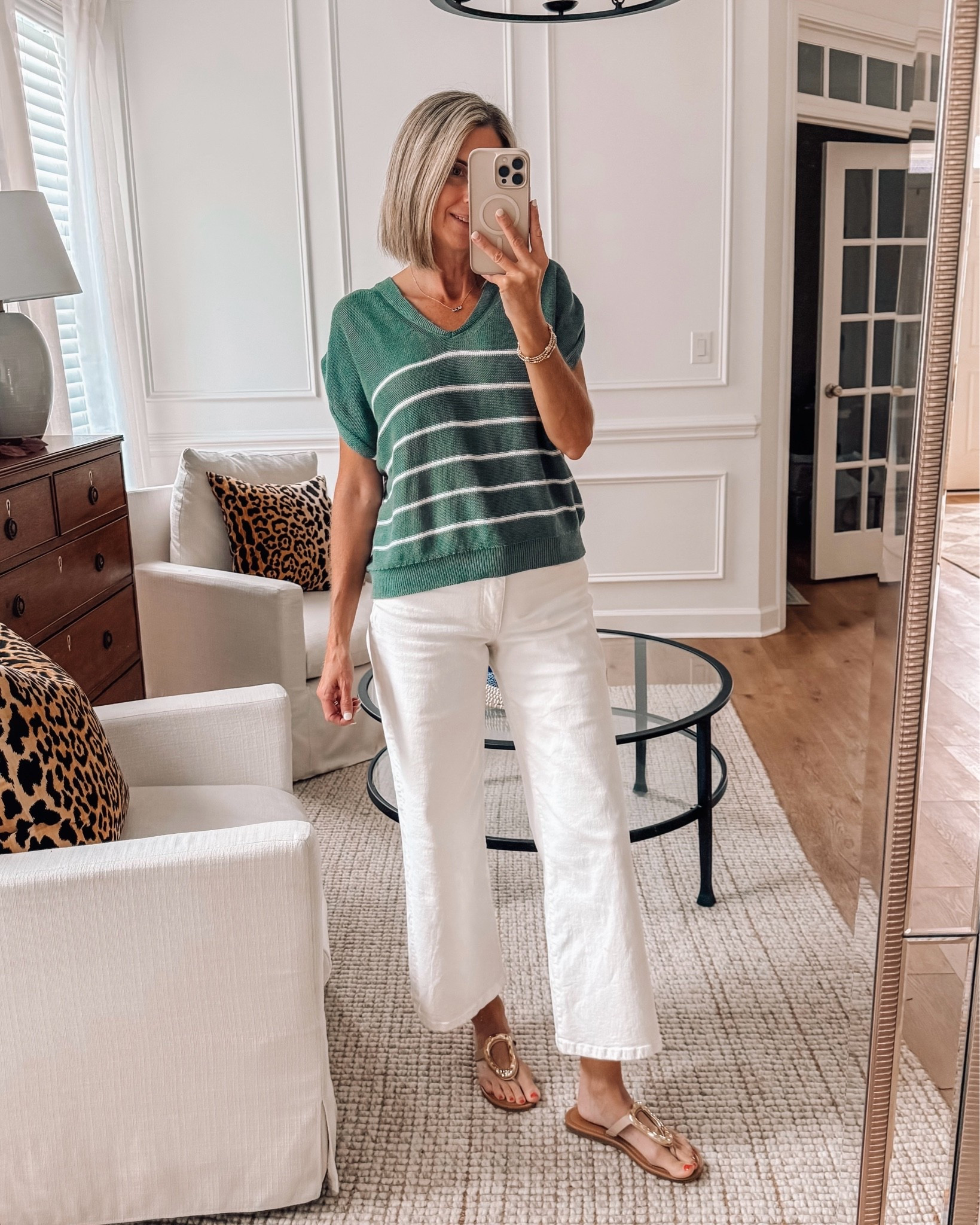 A lightweight sweater is perfect for our in between weather right now.  Casual but put together 💚 🤍 The perfect everyday outfit

Wearing size xs top and size 2 jeans