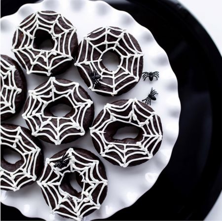 Quick + Easy Halloween treat for the whole Family! 🕷🕸 

Simply take a chocolate donut and white frosting and pipe a web design on top of the donut 🍩 

Enjoy! 

#LTKHalloween #LTKhome