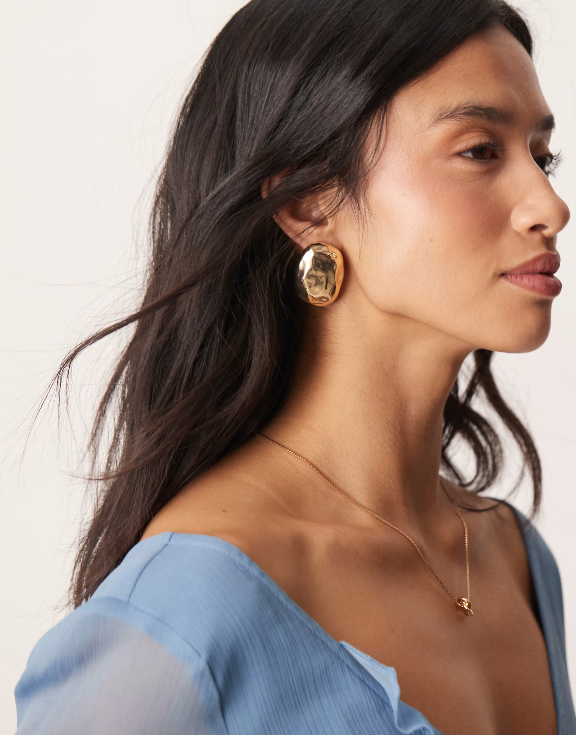 ASOS DESIGN stud earrings with molten oval detail in gold tone | ASOS (Global)