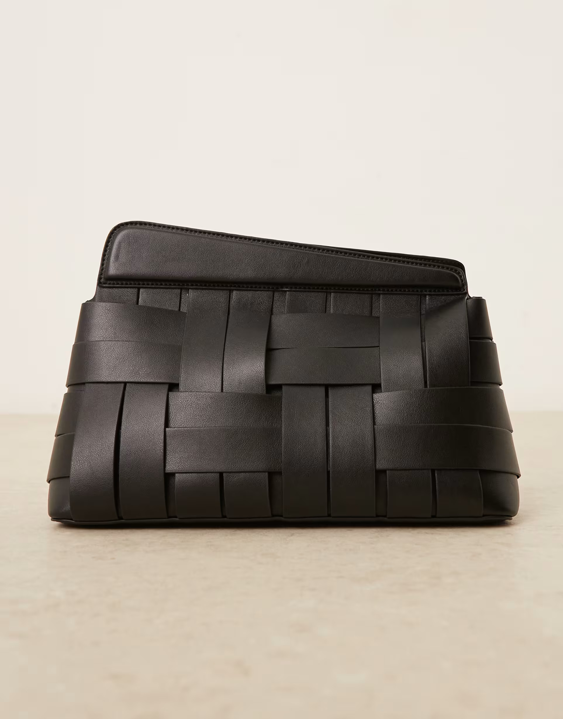 ASOS DESIGN asymmetric woven grab clutch bag in black | ASOS (Global)