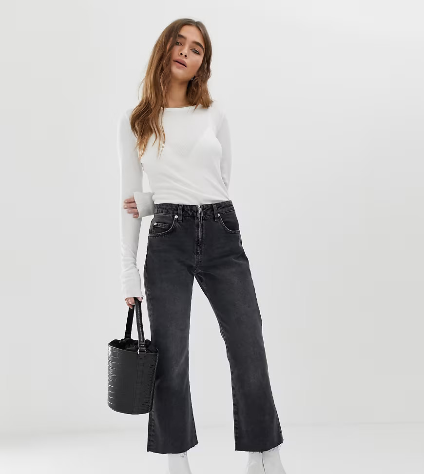ASOS DESIGN Petite Egerton rigid cropped flare jeans in washed black with zip fly detail | ASOS (Global)