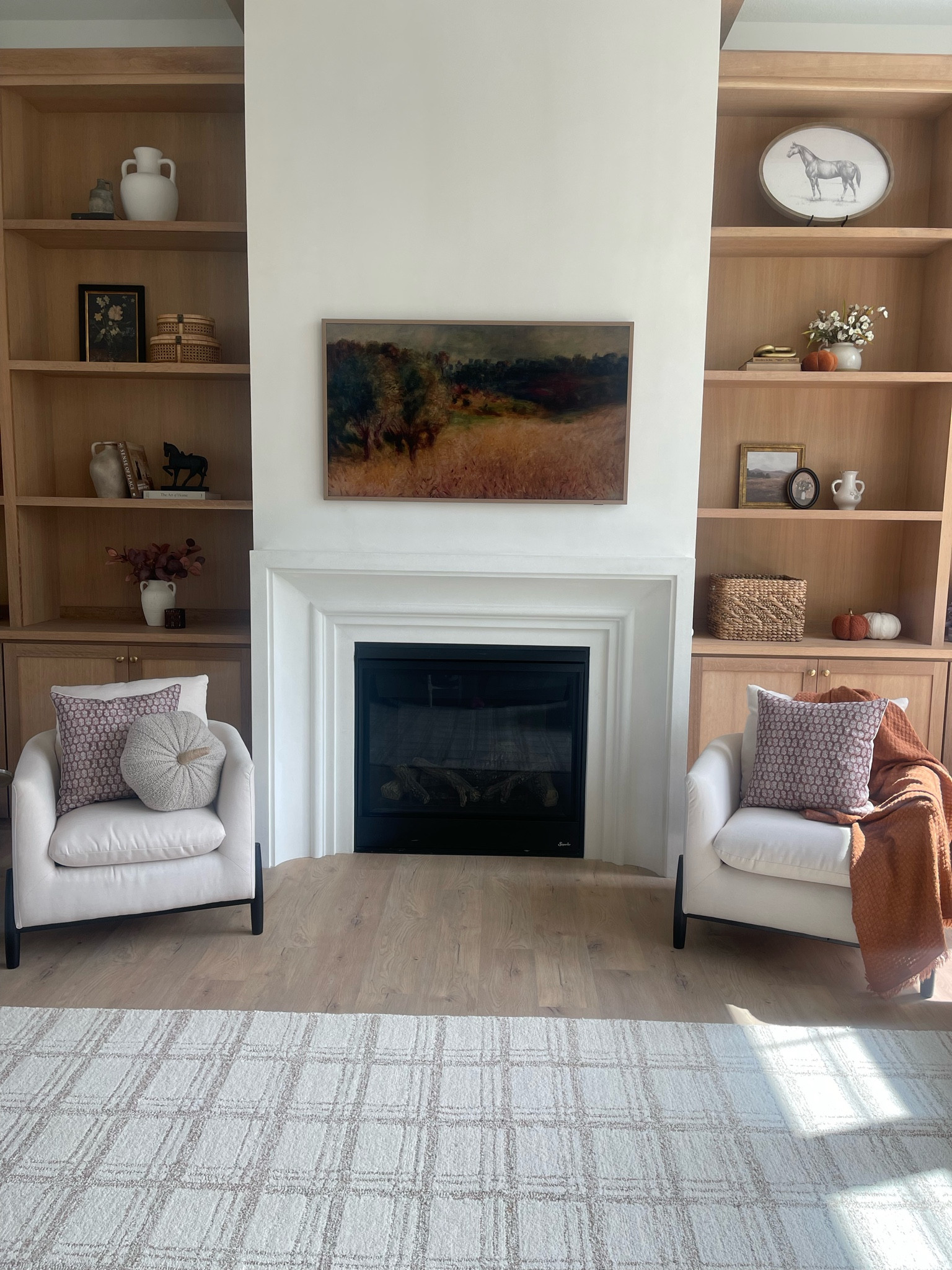 Fall Home Decor // Livingroom Home Decor // Chris Loves Julia Polly Area Rug // Elroy Accent Chair // Amazon throw pillow covers // Built in Shelf Decor and Styling // 

#LTKSeasonal #LTKHome