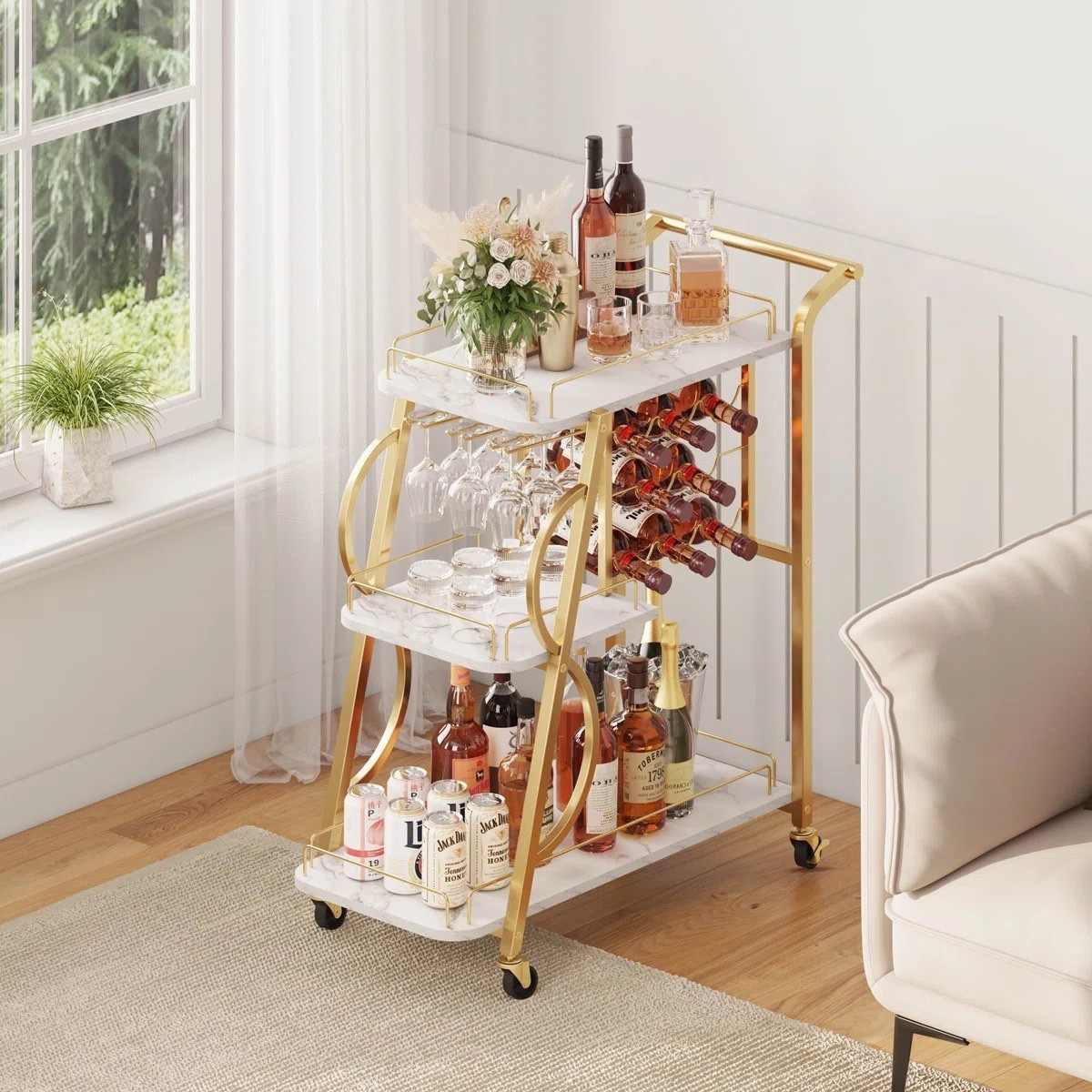 Looking for a bar cart for your home? This rolling liquor cart with wine glass holder is perfect for entertaining, storage, and stylish hosting. ON SALE and under $150

Keywords: Gold bar cart, rolling bar cart, rolling bar cart with shelves, circle bar cart, home decor, bar cart for entertaining, mirrored bar cart, luxury bar cart, modern bar cart, modern luxury bar cart

#LTKHome #LTKSaleAlert #LTKSeasonal