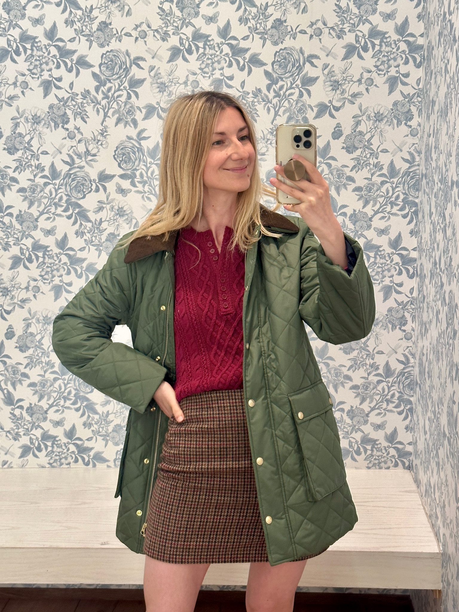 Fishermen’s cable knit sweater paired with quilted hunting inspired jacket and short wool skirt 