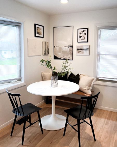 Kitchen dining nook with round table and bench. Making it cozy with some pillows. 

#LTKstyletip #LTKsalealert #LTKhome