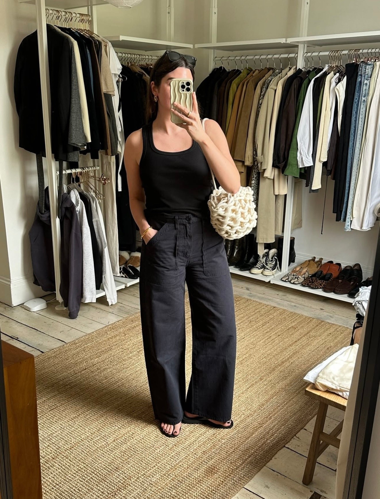 An all-black look with a fitted ribbed tank and cargo trousers elevated with a knit bag to add texture. Great for errands or a casual lunch.

#LTKstyletip #LTKsummer