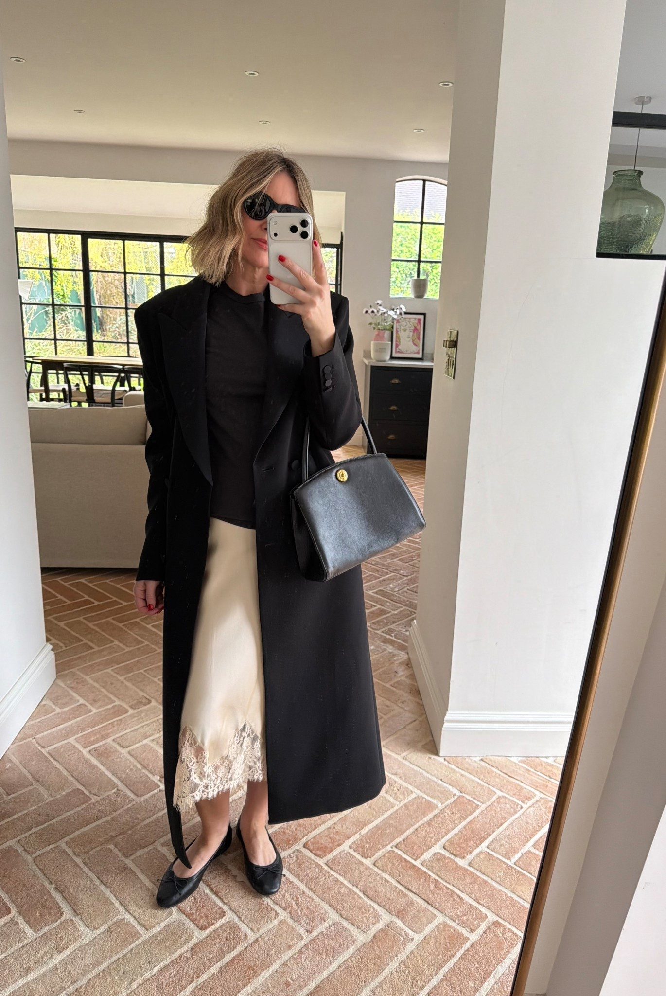 Ad Reformation Satin slip skirt + long coat 🖤

#LTKspring #LTKuk #LTKeurope