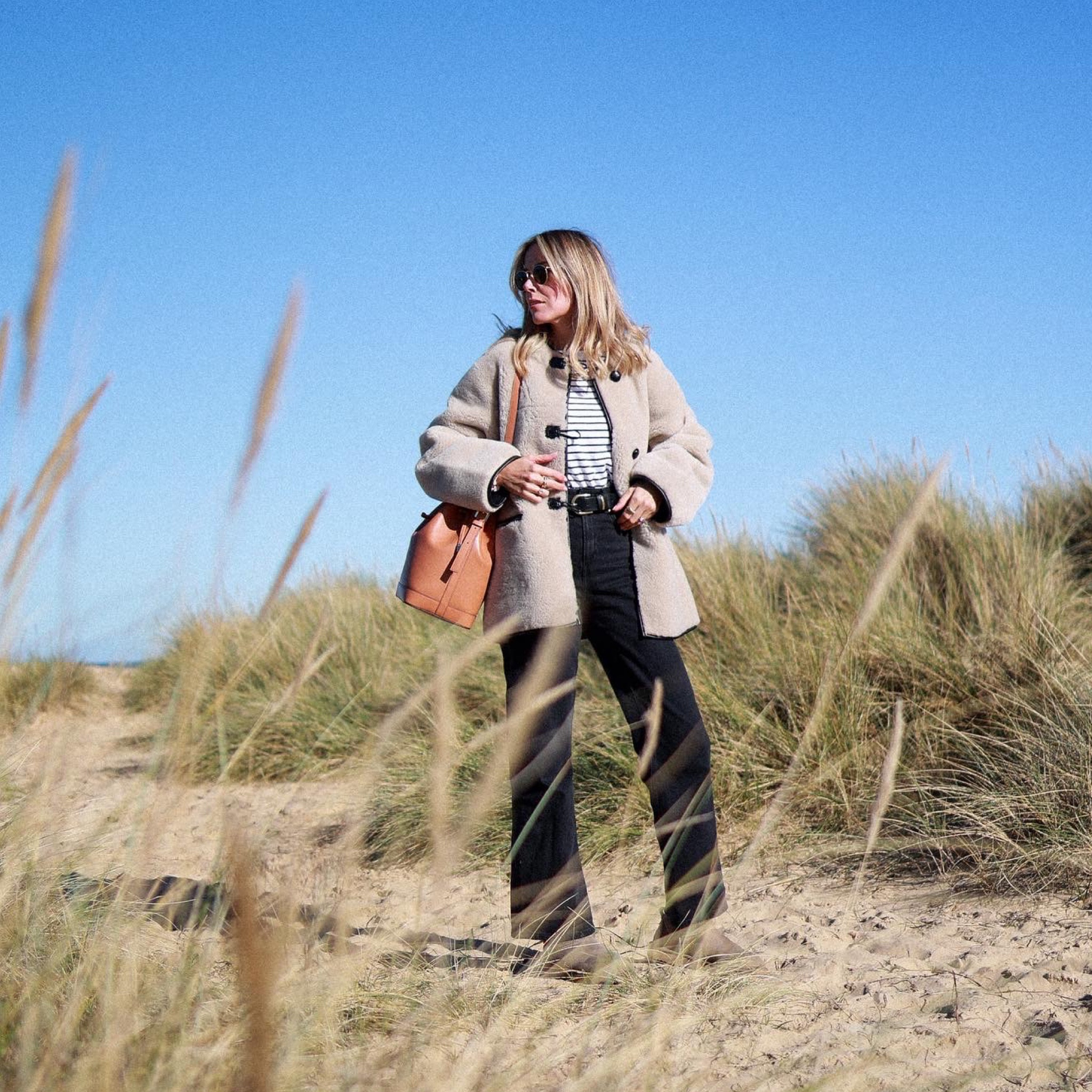 Shearling jacket 
Mango shearling coat 
Black jeans 
Striped tshirt 
Striped top 
Ugg ultra mini 

#LTKSeasonal #LTKstyletip #LTKeurope