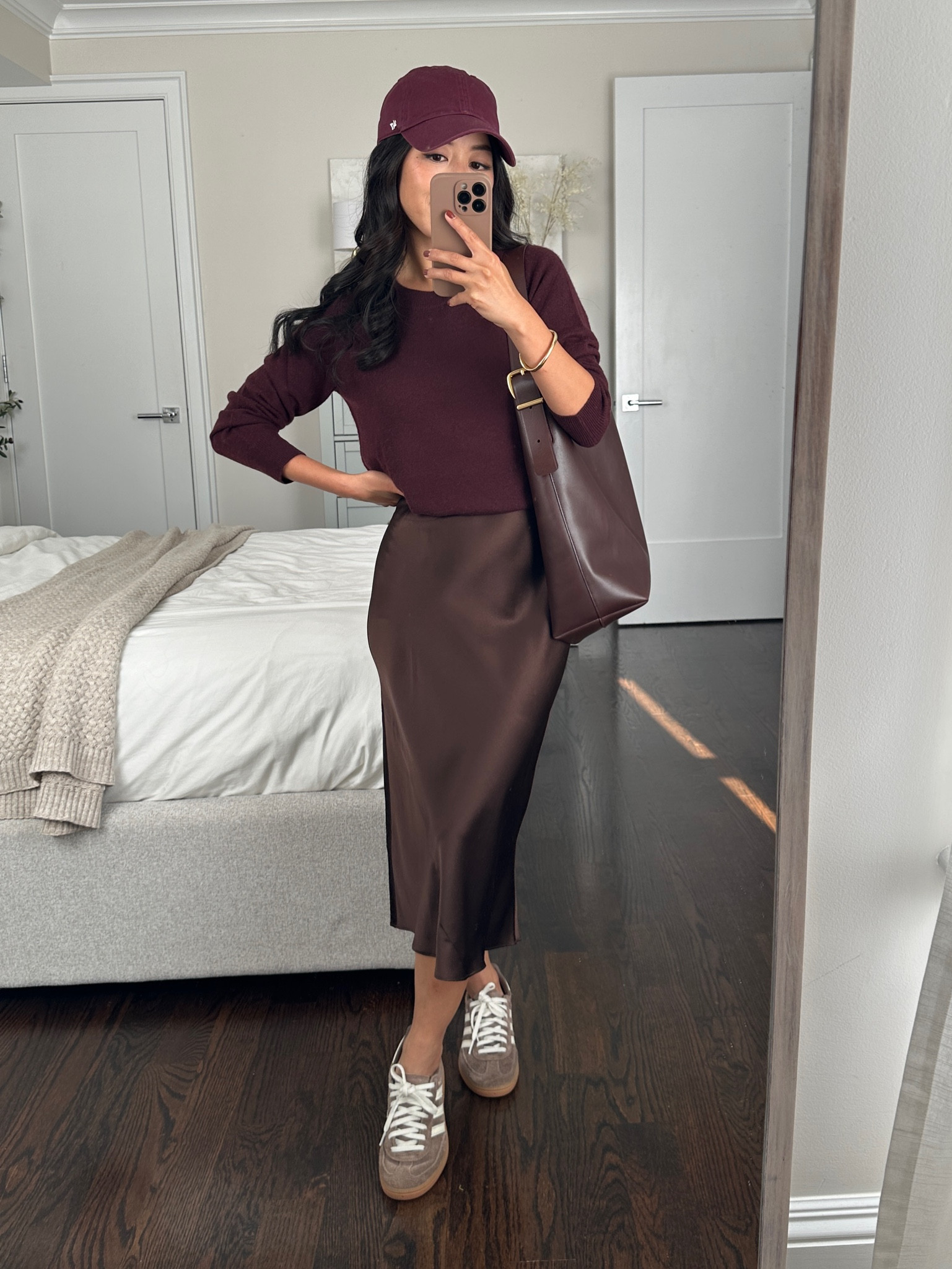 Burgundy & chocolate brown elevated casual outfit from my fall capsule wardrobe 
 
• Quince silk chocolate brown slip dress xs

• their $50 cashmere style is stocked in this color 

If you’re petite I ended up getting their cashmere sweatshirt in xs but now sold out in burgundy. Has a slightly shorter more petite friendly length and banded waist. 

•47 brand burgundy baseball cap 

• Madewell essential bucket tote
 
• Adidas Spezial sneakers 5, runs half size big 

#LTKSeasonal