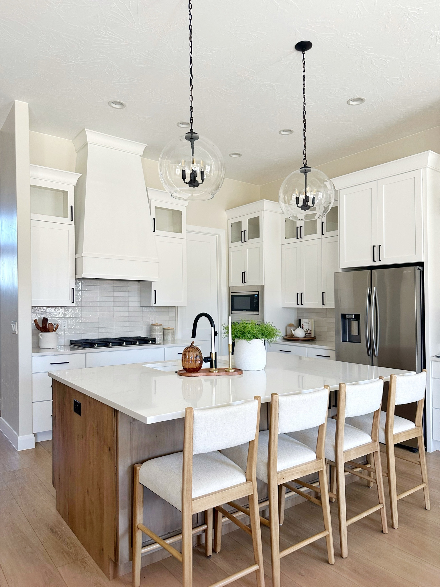 I just added new pendant lights over my kitchen island and wow, what a difference! These lights make a statement but not over taking the space with a light an airy feel. Shop the kitchen lights, barstools, and neutral kitchen decor here.
The best part about this project, the pendant lights are under $100.00 each but look high end! 

#LTKFindsUnder100 #LTKSaleAlert #LTKHome