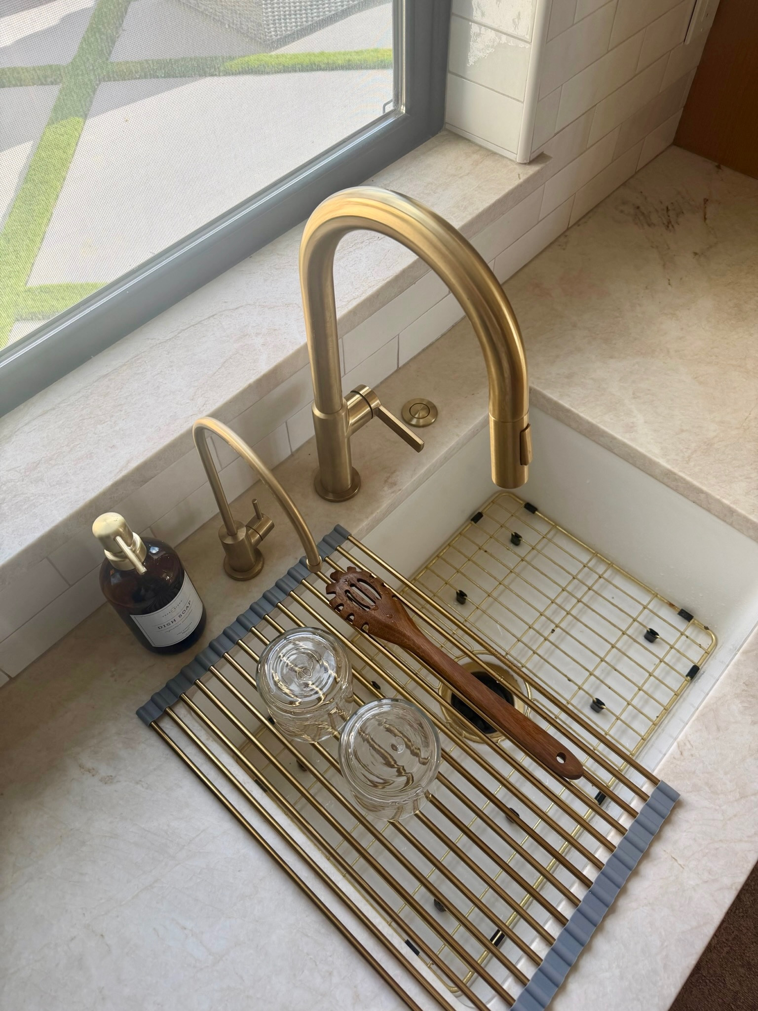 I use this "roll-up sink drying rack and brass sink grid" to keep the kitchen sink area clean and organized without taking up counter space. The rack is perfect for drying glasses, utensils, or produce, and it rolls away easily when I want the sink completely clear.

I like simple kitchen tools that make everyday routines easier while still looking polished. These pieces protect the sink, help dry dishes, and keep the space tidy. I’ve linked the ones I use below.
@Wayfair
@Amazon 

 #LTKU #LTKHome #LTKSaleAlert