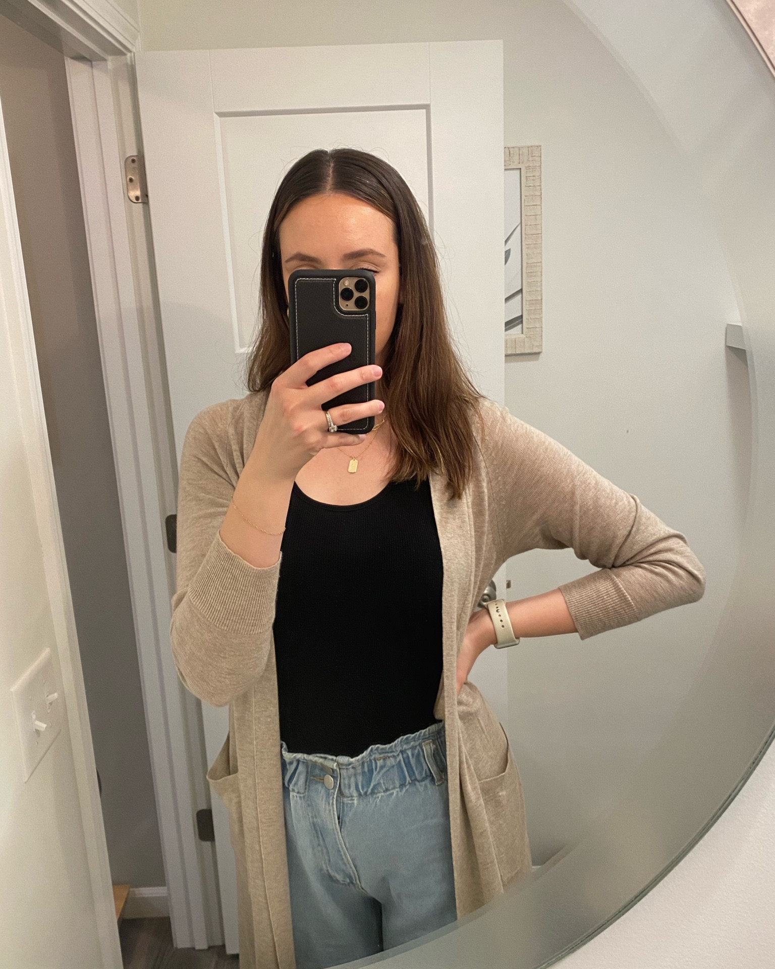 Black bodysuit. tank top bodysuit. Paper bag pants. Paper bag jeans. Tan cardigan. Long sleeve cardigan. Everyday look. Gold jewlry. Gold necklace. Paper clip necklace. Layered necklace. Gold earrings. Beige cardigan. Long cardigan. Bodysuit. Women’s jeans. 

#LTKstyletip #LTKfit #LTKFind