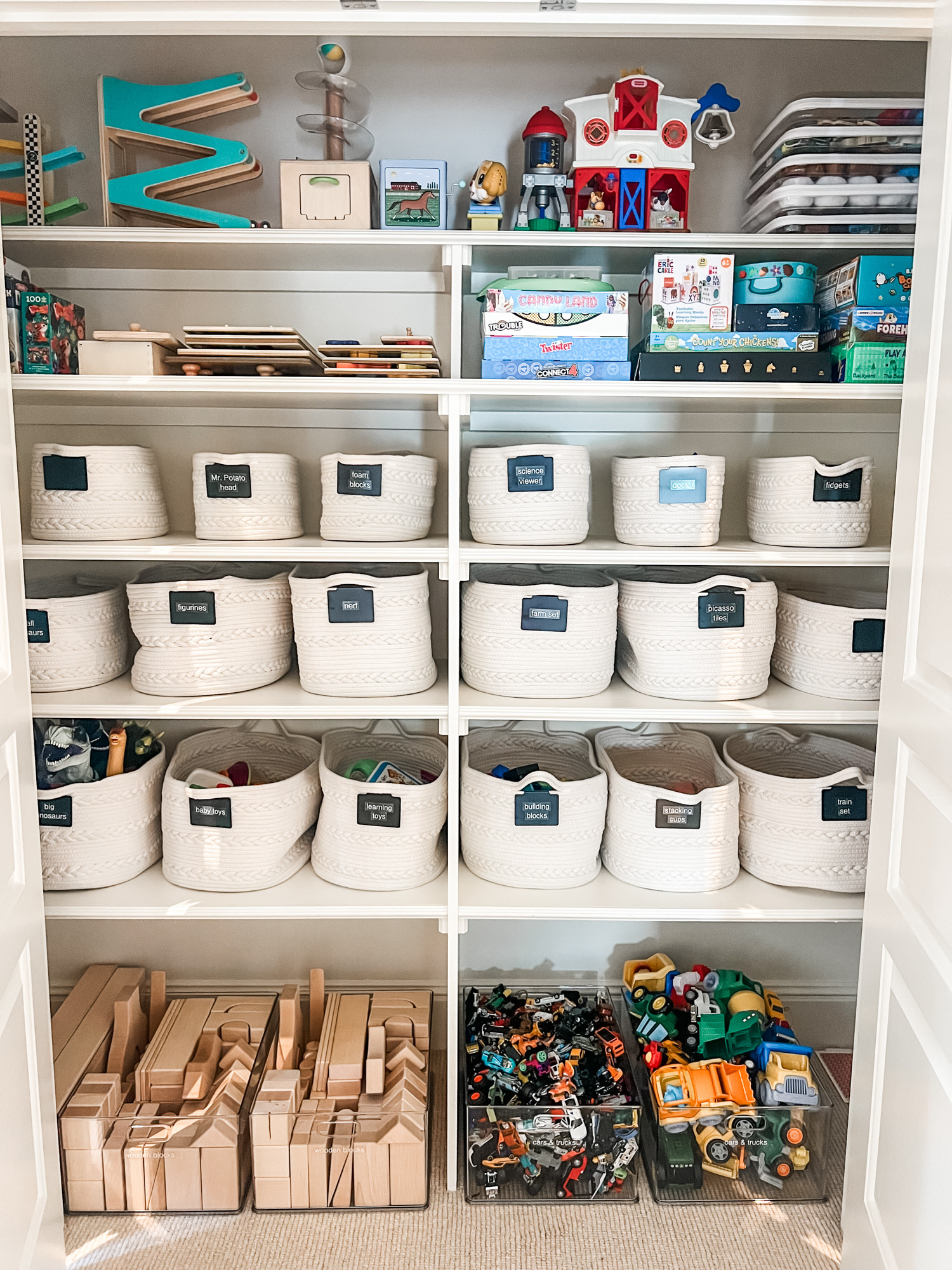 Playroom closets are always a fun challenge especially when you've got kids of various interests and ages. Setting up systems that walk that line of organized yet fluid are our sweet spot. This kind of set-up makes it easy for kids to find what they want (and put it away) and the caregiver can get a couple bins out at a time so that the toys can rotate and stay 'new'. Plus, our end goal is always making cleanup a breeze! 

 