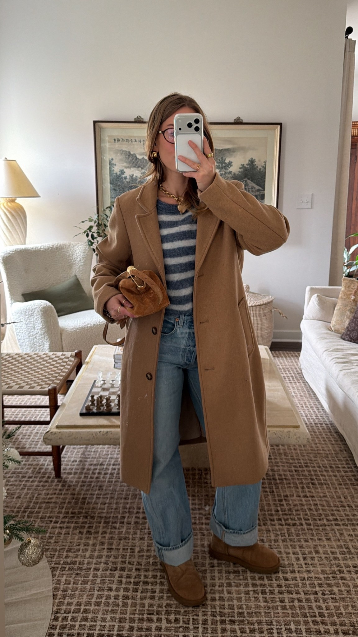 12/6/25 today’s casual winter outfit — cozy, practical, and perfect for chilly days. Linking my UGG boots, my cuffed Aritzia baggy jeans, my striped American Vintage sweater, and my Abercrombie wool trench coat. Also adding my Amazon blue light glasses and the suede J.Crew purse I’ve been reaching for nonstop.

#LTKootd #LTKHoliday #LTKgrwm