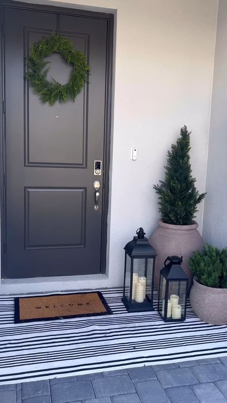 Winter Front Porch Styling #outdoor #frontporch #outdoorrug #outdoorplants 

#LTKhome #LTKSeasonal