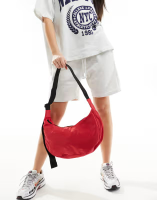 Baggu medium nylon crescent crossbody bag in red | ASOS | ASOS (Global)