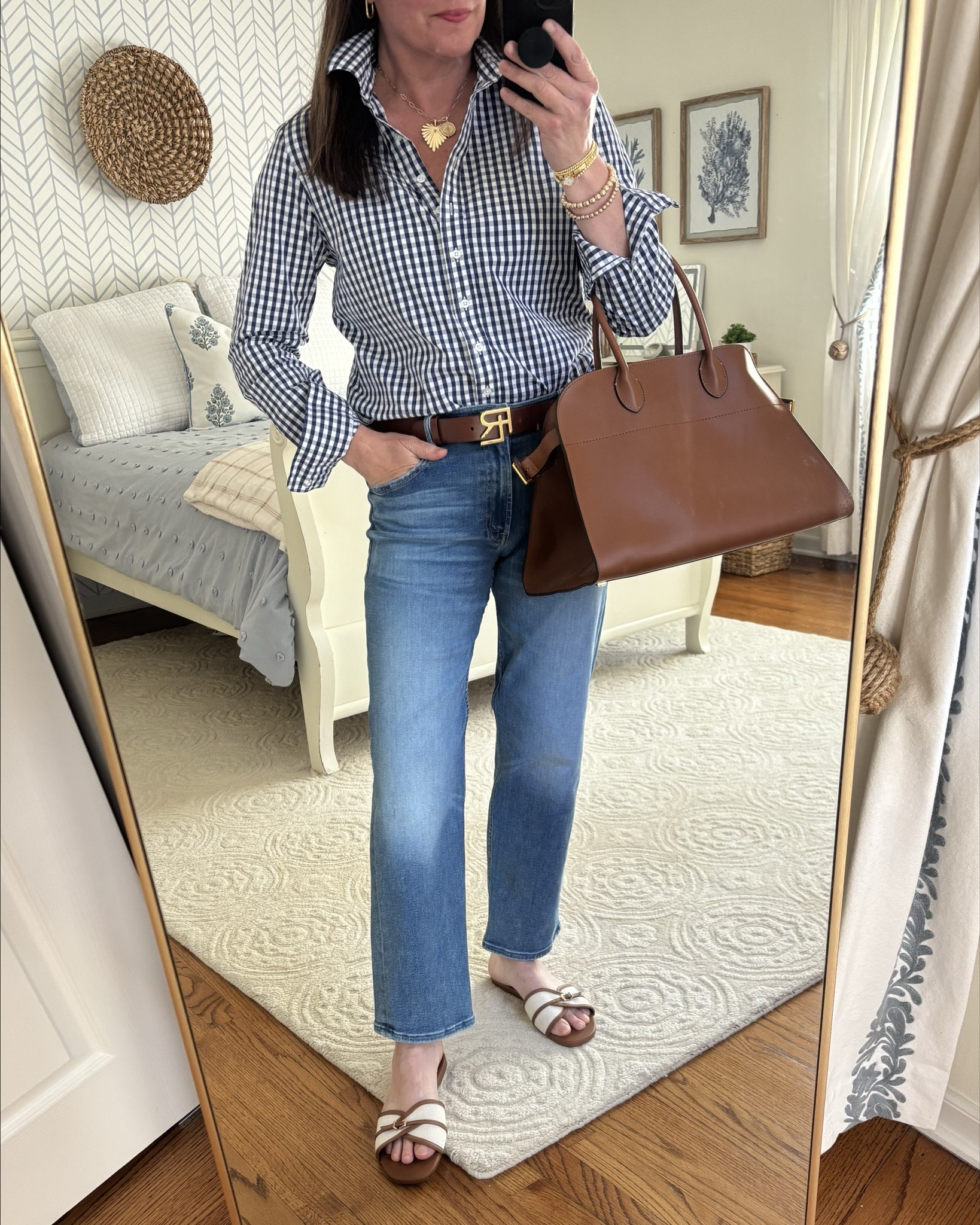 This classic button down is a closet staple! Love the fit and fabric of this cute navy check version. Also available in solid colors. 