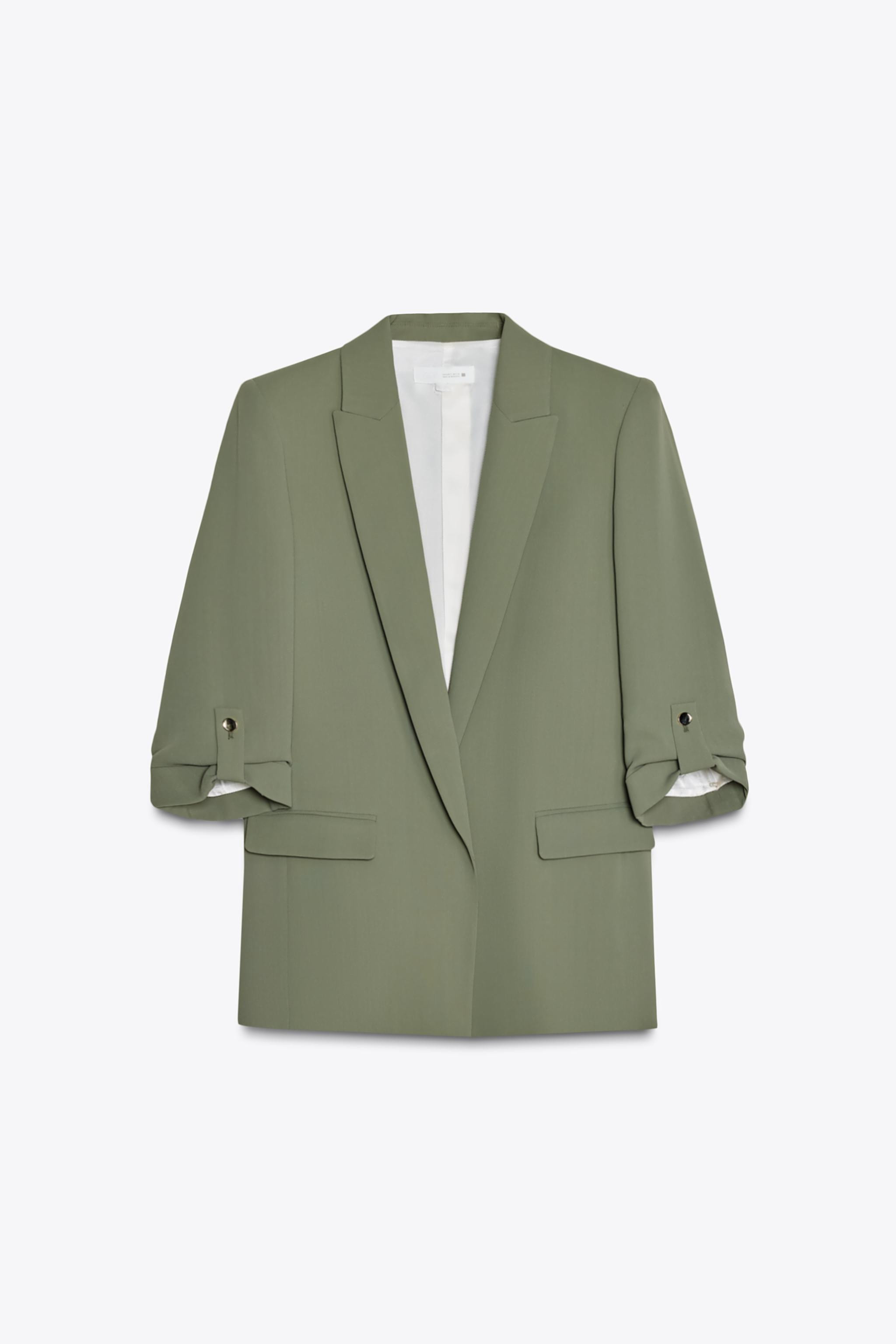 Open front blazer with lapel collar and shoulder pads. Below-the-elbow length cuffed sleeves with... | Zara US