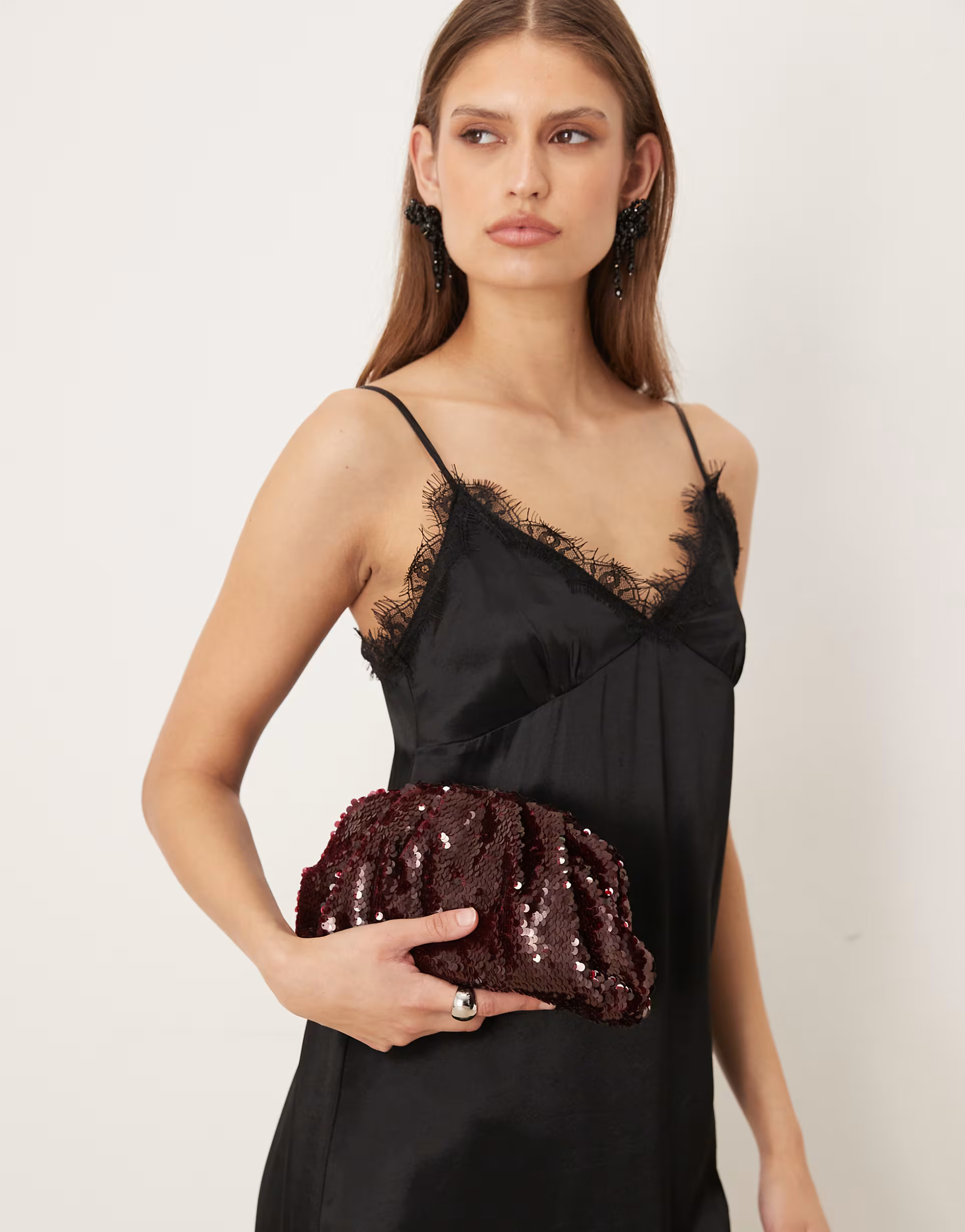 Sui Ava sequined pleated clutch purse in burgundy | ASOS (Global)