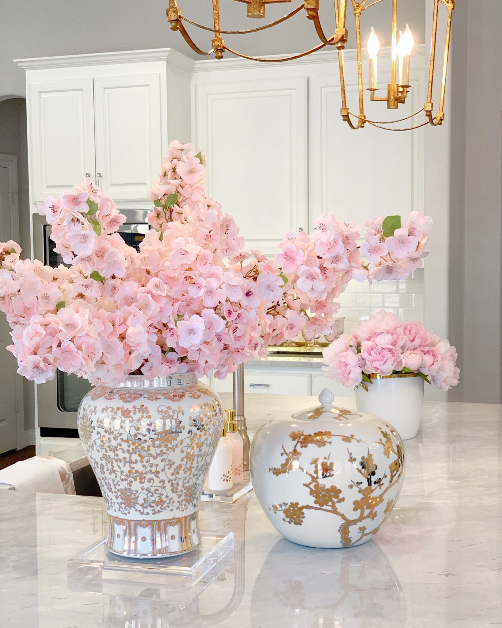 Faux cherry blossoms and pink peonies 💗 white and gold ginger jars spring decor acrylic risers 

#LTKunder50 #LTKhome #LTKsalealert