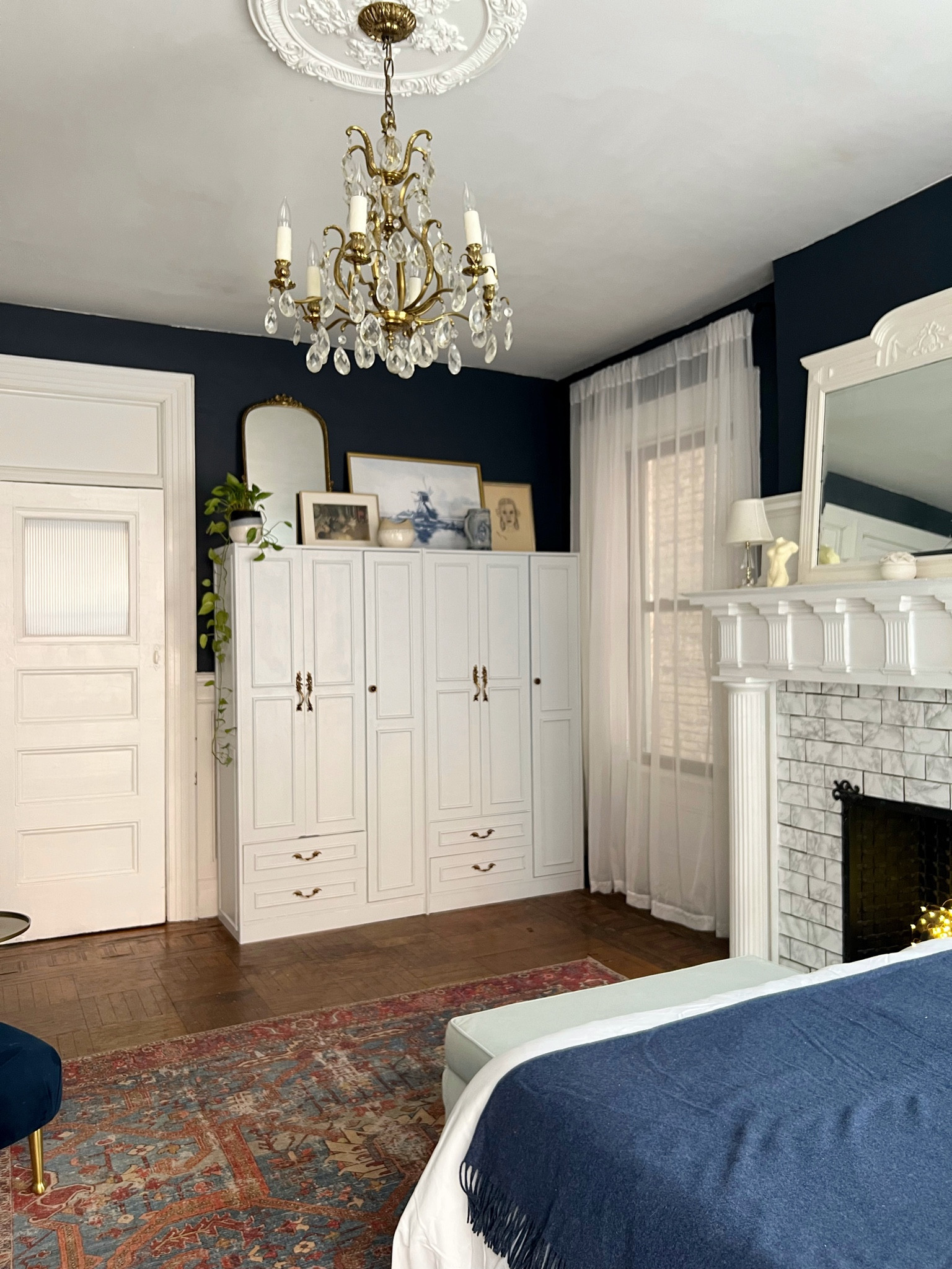 Bedroom details 

Wardrobe, vintage knobs, crystal chandelier, ceiling, medallion, art, mirror, white, sheer curtains, powder, blue, velvet storage, bench, navy, blue, throw blanket, mini glass lamp 

#LTKhome #LTKstyletip #LTKFind