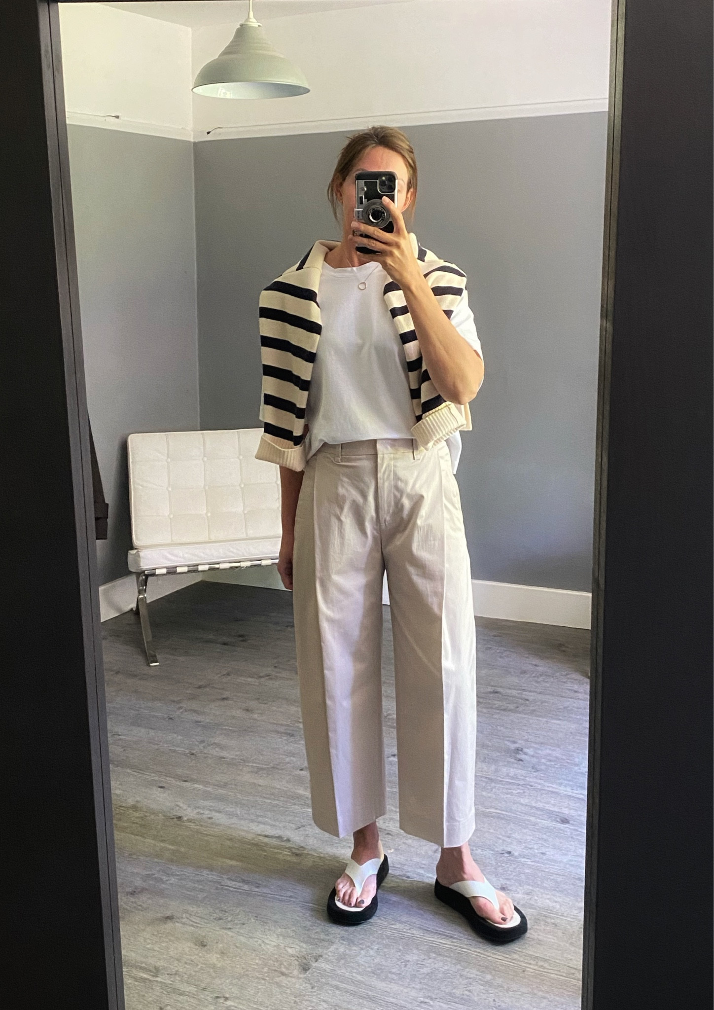 Barrel leg trousers from Cos, a simple white tee from Arket and a striped jumper drape. Easy summer outfit x
I’m in a small tee. I’m in size 38 trousers