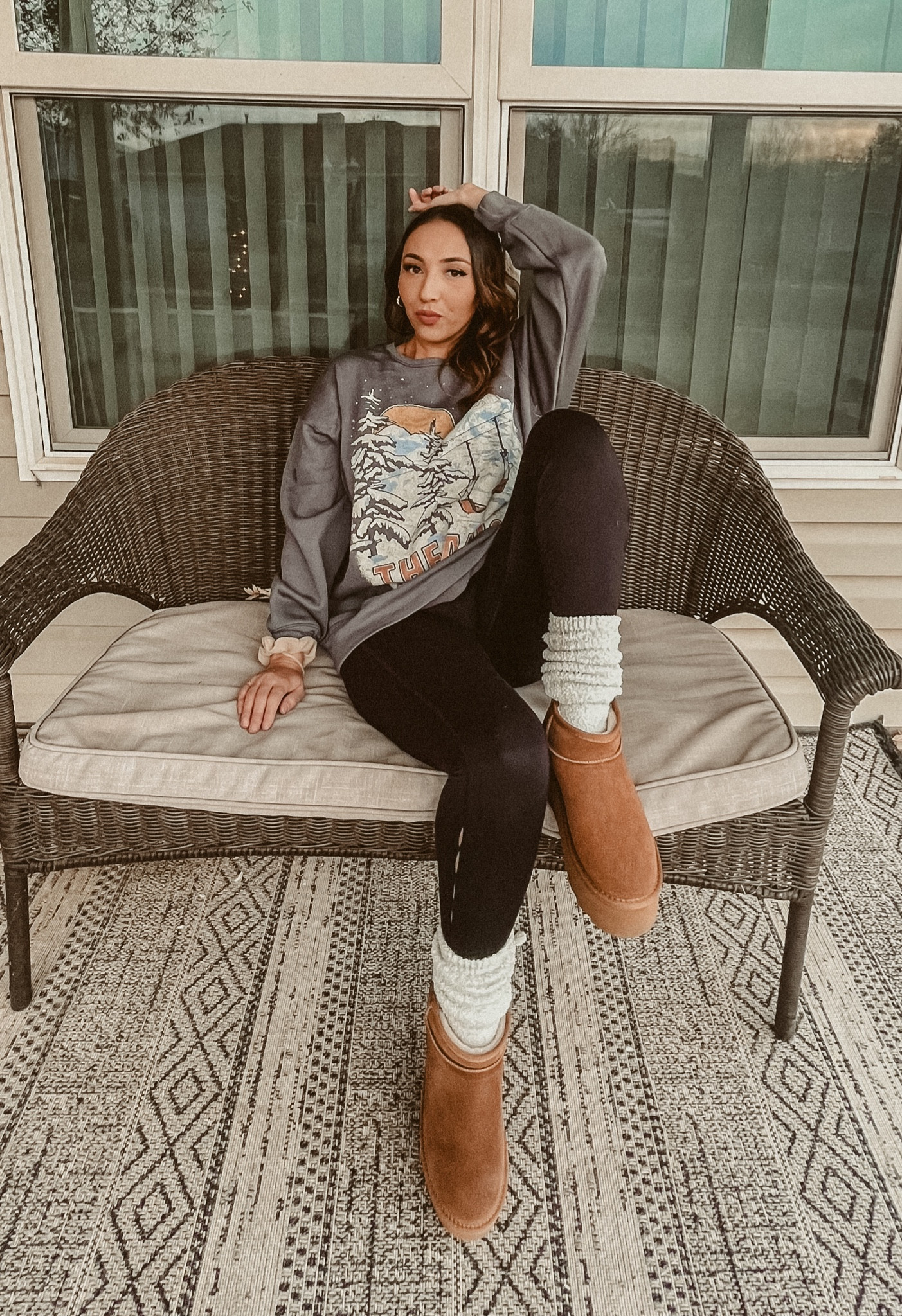 Sweater in large for oversized fit. Boots 7.5 would size up for a more comfortable fit. 