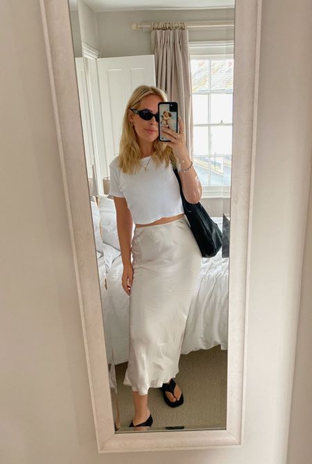 White outfit, summer outfit, casual outfit, brunch outfit, monochrome outfit, lunch outfit, date day outfit, summer day outfit, white skirt, maxi skirt, satin skirt, white cropped tee, ribbed crop tee, black cat eye sunglasses, black sunglasses, oval sunglasses, crescent bag, black leather bag, chunky flip flops, platform flip flops, black leather flip flops, & Other Stories, Arket, Cos, Uniqlo, Prada, Reformation, Nobody’s Child

#LTKstyletip #LTKeurope #LTKSeasonal