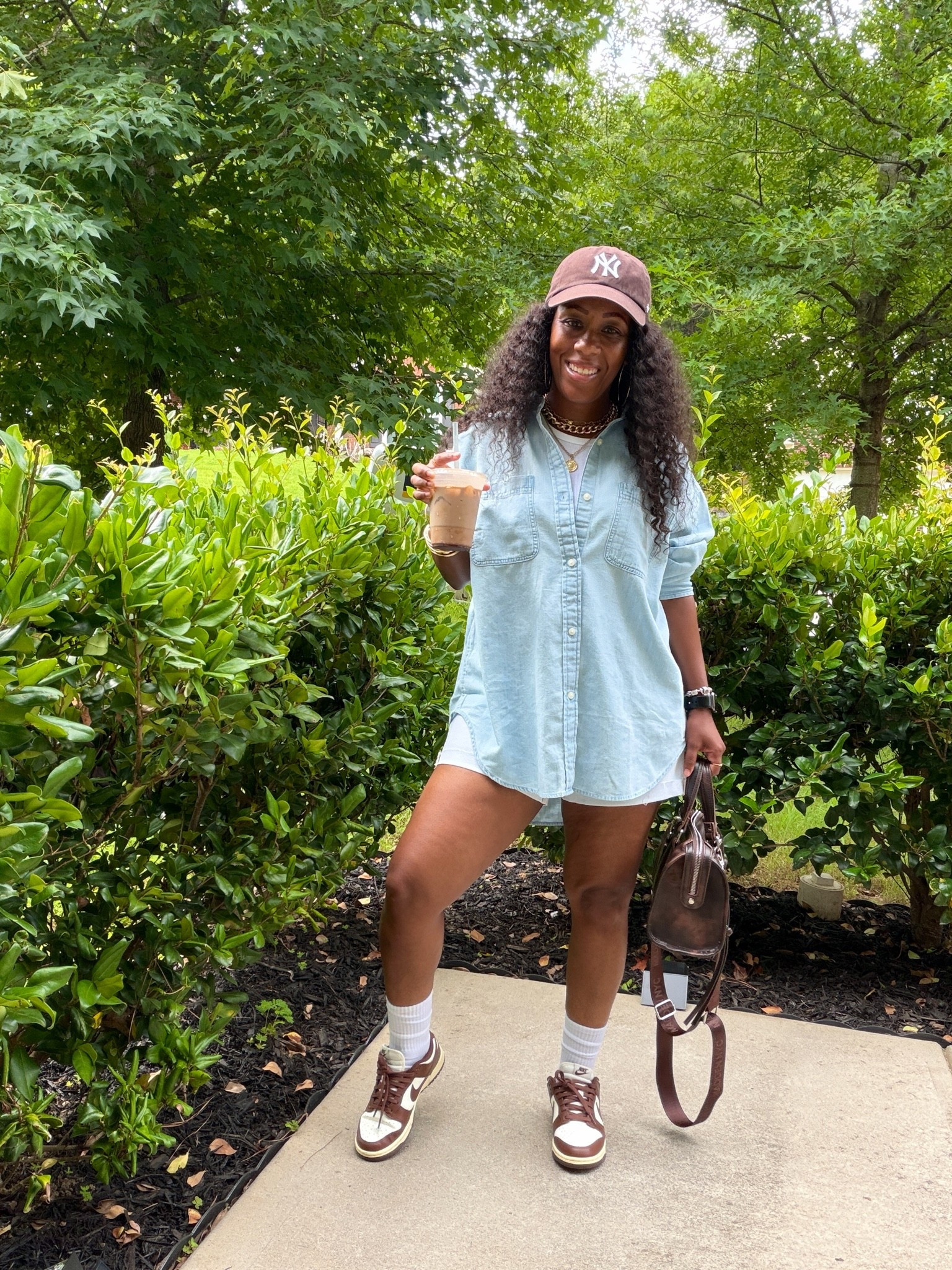 My go to coffee run outfit. I’m wearing an oversized Aerie woven shirt over a white tank with American Eagle high rise denim shorts, a brown New York Yankees hat, and Nike Dunk Low Cacao Wow sneakers

#LTKootd #LTKOver40 #LTKPetite