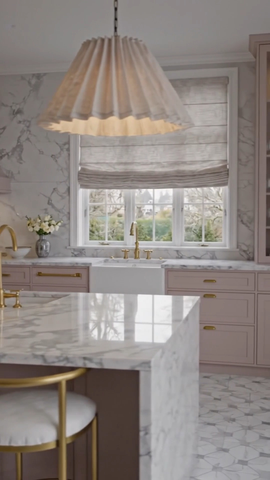 A beautiful way to start the week—with a kitchen that feels bright, polished, and organized. ✨

The clean-lined waterfall kitchen island brings a modern architectural feel, while the glass-front cabinets keep everyday pieces beautifully displayed and easy to reach. Soft blush cabinetry, woven pendant lights, brass counter stools, and the Roman shade slowly lifting to welcome the morning light create a kitchen that feels elegant, functional, and ready for a fresh start.

#KitchenDesign #KitchenIsland #WaterfallIsland #GlassCabinet #RomanShade #KitchenOrganization #BrassCounterStools #PendantLighting #BlushKitchen #ModernKitchen #romanshade #KitchenInspiration #InteriorDesign

#LTKdayinmylife #LTKHome #LTKSaleAlert