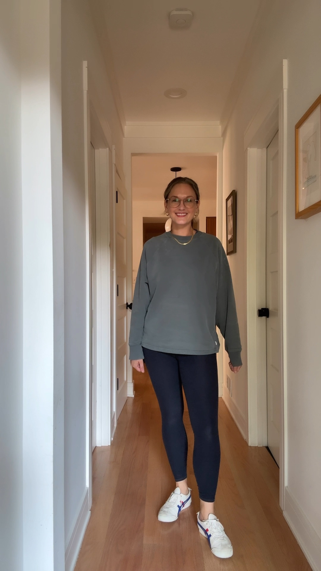 It’s a whirlwind Wednesday in August, and the city mom is rocking navy leggings and a blue cropped athleisure tee layered under a teal sweatshirt, her favorite sneakers keeping her grounded through the chaos. Her go-to gold hoops and signature herringbone necklace peek out from under the layers, while her new stack of permanent bracelets jingles with every hurried step. The morning starts with her husband off to work with the stroller tucked in the trunk, leaving her to walk—and sometimes carry—her son to daycare, only to remember mid-stride that it’s water day and he desperately needs a swimsuit, prompting a mad dash back home. Somewhere between the swimsuit change and the trek to daycare, she pulls a muscle in her back, but a quick session at physical therapy lets her start addressing it before the day spirals further. She had every intention of swapping out her athletic clothes afterward, but after hours spent on blog posts and planning her new author event series, she’s still in her sweat-ready ensemble just before daycare pick-up—proof that sometimes style is all about surviving the chaos with a little sparkle and a lot of grit.

#LTKautumn #LTKFamily #LTKActive