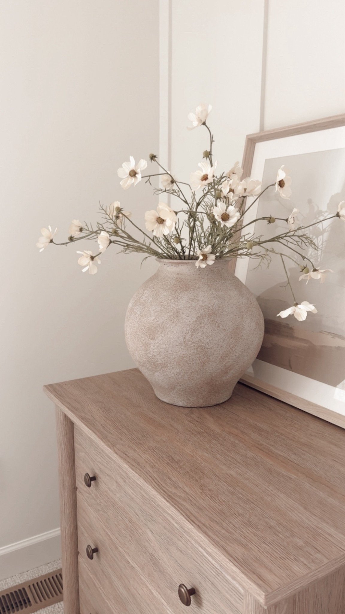 Spring nightstand style. The vase is HomeGoods and the daisies are hobby lobby, but I can link my Walmart dresser and framed art. 