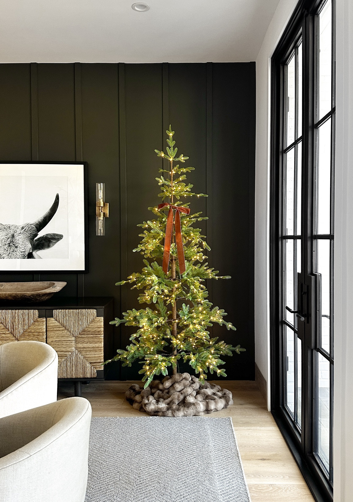 A few years back, I tried to find smaller tree skirts for these trees but they just looked flat and unsubstantial.  After brainstorming, I decided to try using faux fur blankets and was blown away by how they looked!  

#LTKHome #LTKHoliday #LTKSeasonal