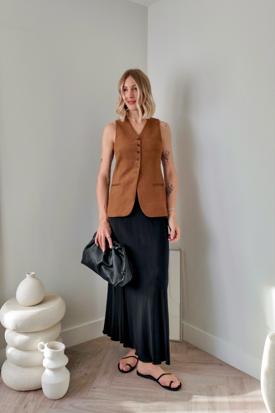 Holiday Outfits | suede waistcoat - black satin maxi skirt - Ancient Greek sandals 

#LTKtravel #LTKeurope #LTKuk