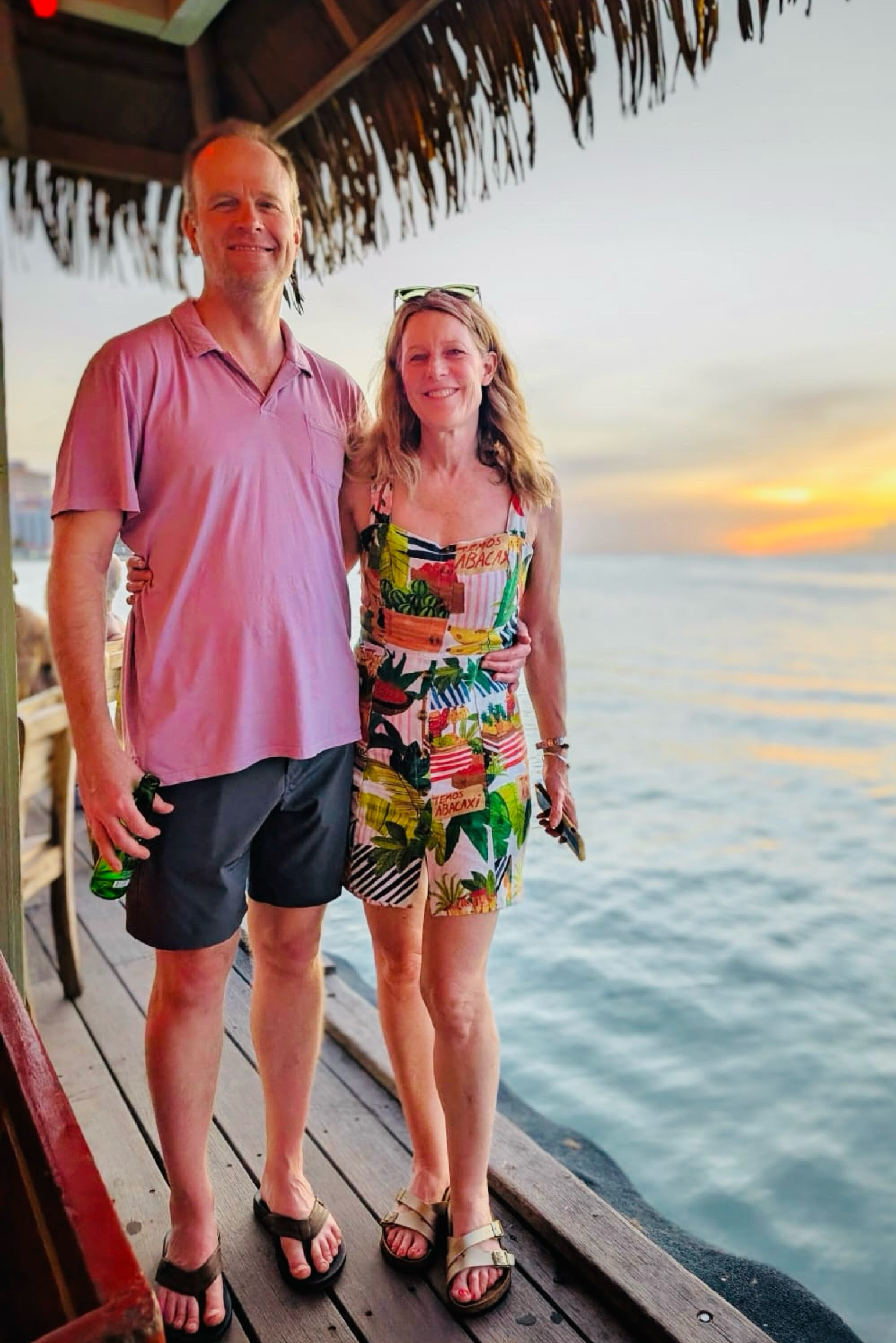 Hello from Aruba! ☀️🌊🐢 
After lots of solo travel it’s wonderful to have a week away with Sean, celebrating a friend’s 50th birthday! 

My dress is by Farm Rio, one of my favorite brands for tropical travel and  they are having a sale! Mine is a few years old so I am tagging similar. I find dresses so easy for travel. Farm Rio is true to size. 

Sean is wearing a few of his favorites, by Vuori (shorts) and Marine Layer (shirt). 

My sandals are Birkenstock and his are by Reef. 

#LTKTravel #LTKOver40 #LTKSaleAlert