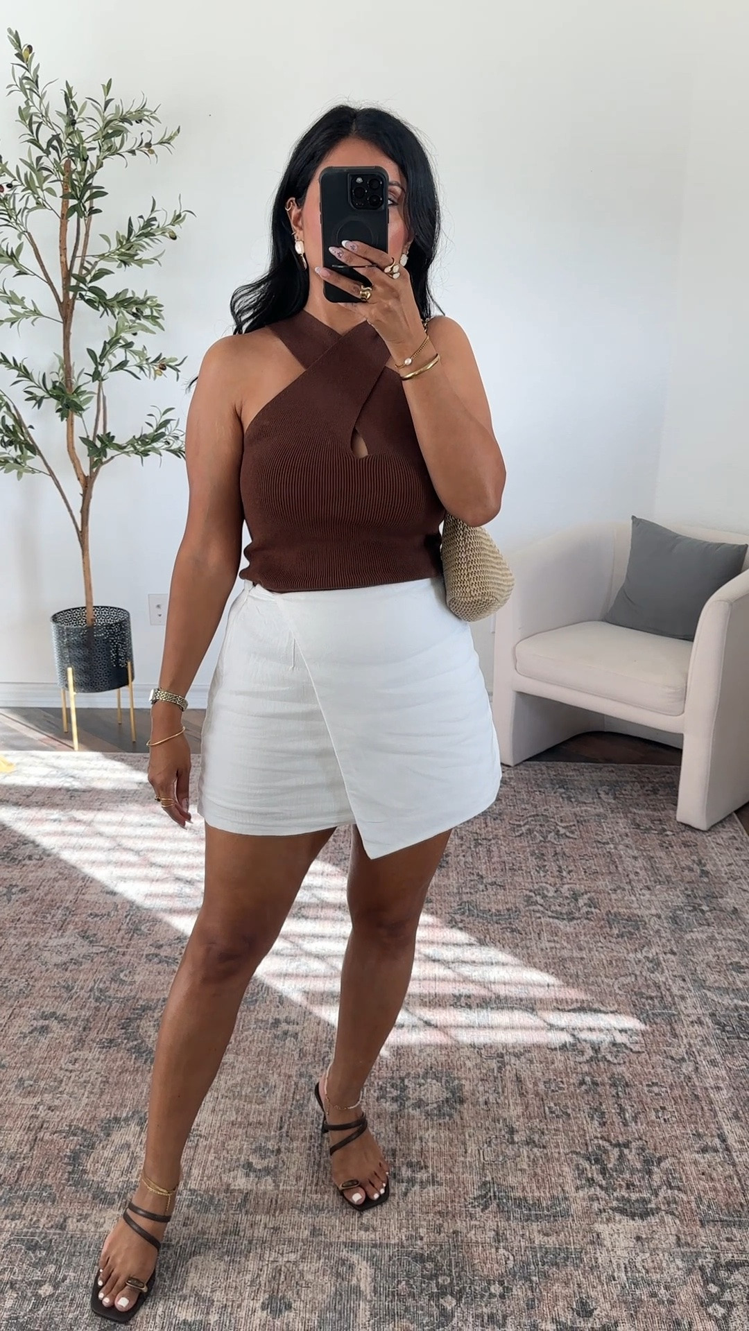 If in between, size down in top. Wearing a medium in the skort, tt, sandals also tts