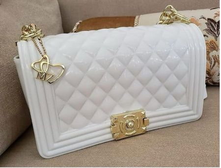 Step into luxury with this quilted white charmer—an exquisite alternative to the classic Chanel flap. Exude sophistication with every detail. #QuiltedElegance #ChanelFlapAlternative #WhiteHandbagLove #ChicAffair #GoldAccentGlamour #TimelessTrendsetter #StyleIconEssentials 

#LTKitbag #LTKfindsunder50 #LTKfindsunder100