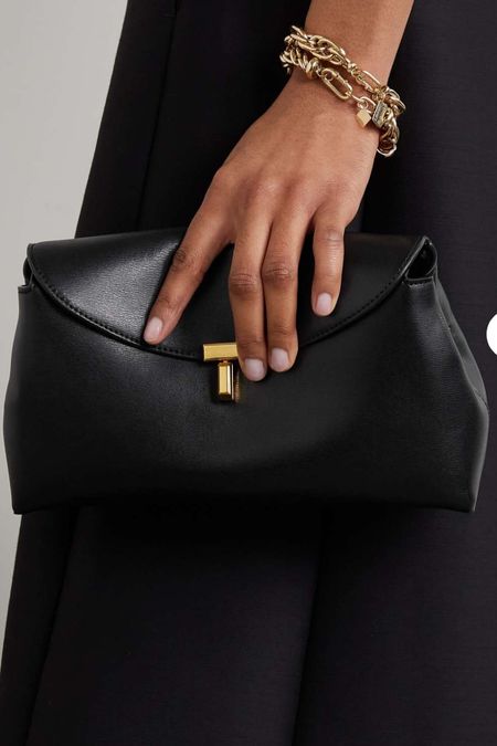 My favorite designer black oversized clutches under $1000. this one is great because it has a shoulder strap as well so it’s really versatile. 

#LTKSeasonal #LTKFind #LTKstyletip
