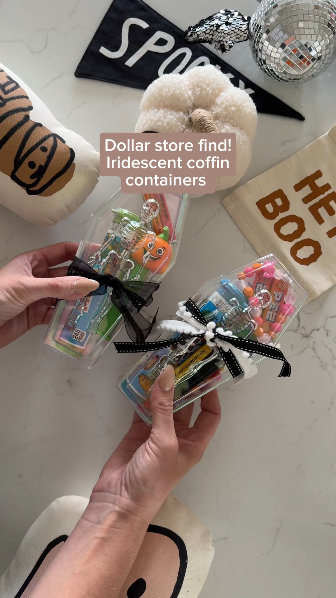 The coffins are from the dollar tree! Here is the link: https://www.dollartree.com/halloween-coffin-shaped-plastic-containers-7625x35x2in/332293

I found these iridescent coffins at the dollar tree and I could not believe they were only $1.25! 

I immediately knew I needed to get them for my kids boo baskets. There are so many different things you can do with these! 

But for mine, I loaded them up with candy and Halloween party favors, and then tied them up with a bow. I’ll be putting them in my kids, boo baskets! 

| Halloween party, boo basket, Halloween party favor, kid Halloween find |

#partyfavors #halloween #halloweenparty #halloweenkids #halloween #trickortreat #halloweenparty #halloweenkidsparty #happyhalloween #halloweendecor #spookyseason #halloweenfun #kidshalloween #halloweenideas #ltkseasonal #halloween ideas

#LTKKids #LTKFamily #LTKSeasonal
