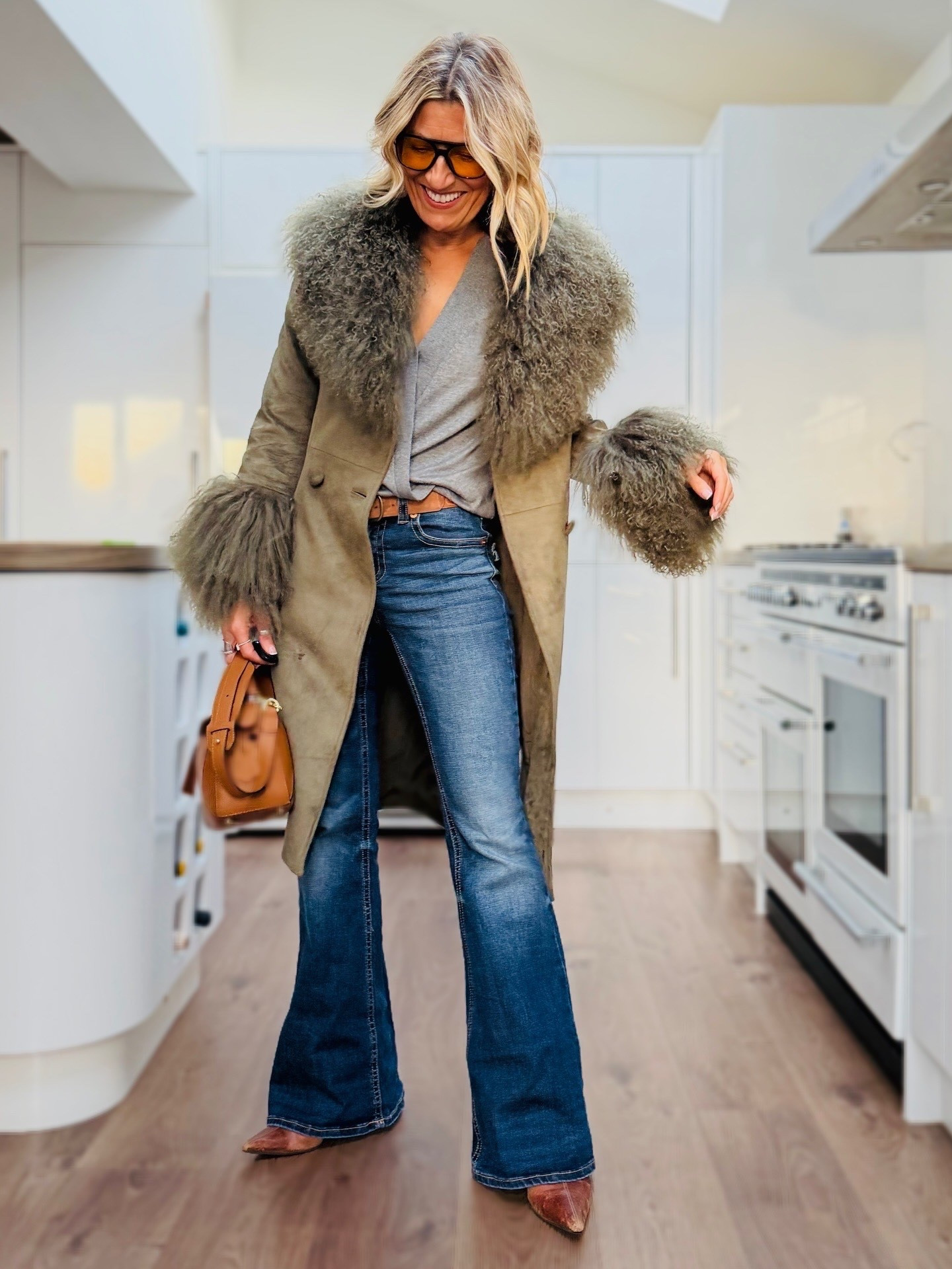 Bringing a touch of 70’s glam to the outfit with this statement coat...

#LTKluxury #LTKwinter #LTKjeans