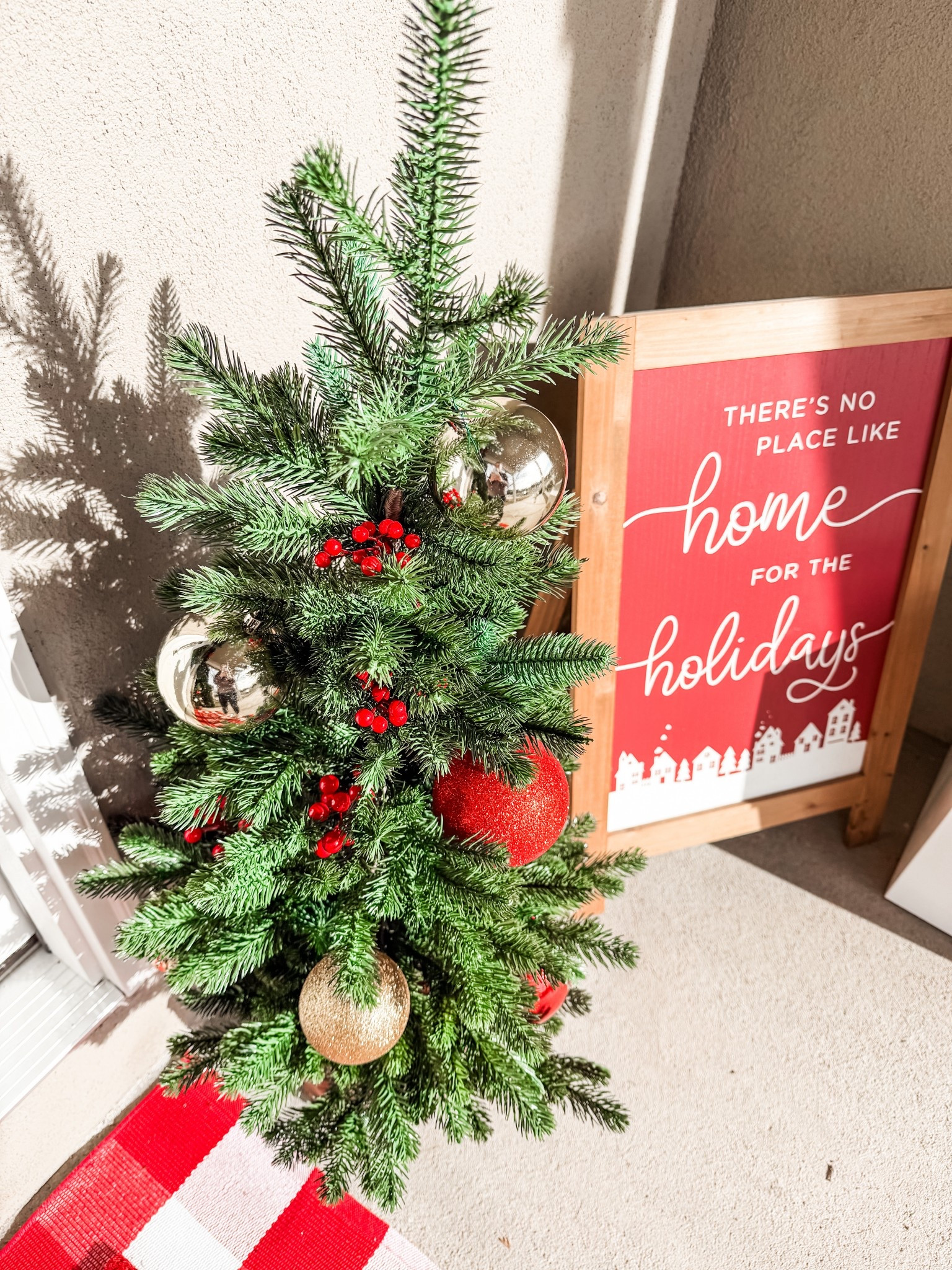 Decorated these target trees with ornaments and filler! Great size with a woven basket base for a front porch! 

#LTKHoliday #LTKFindsUnder100