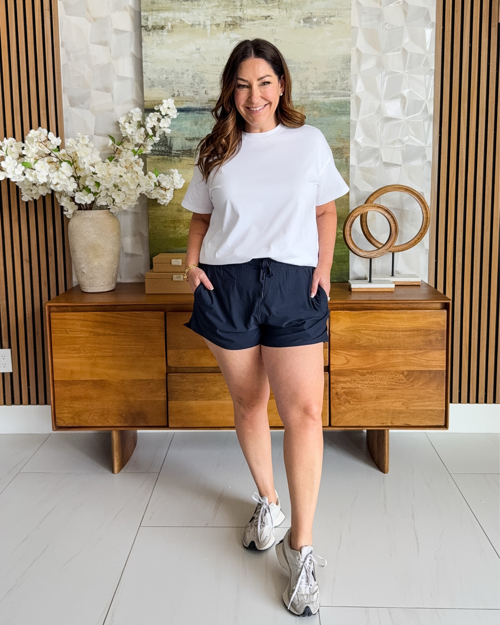 A classic white tee meets sleek navy athletic shorts — clean, sporty, and endlessly versatile. These shorts have under biker shorts, making them very comfortable Sizing: shorts size up, XL #SportyStyle #AthleisureVibes #WorkoutOOTD 

 

#LTKSeasonal #LTKActive #LTKMidsize