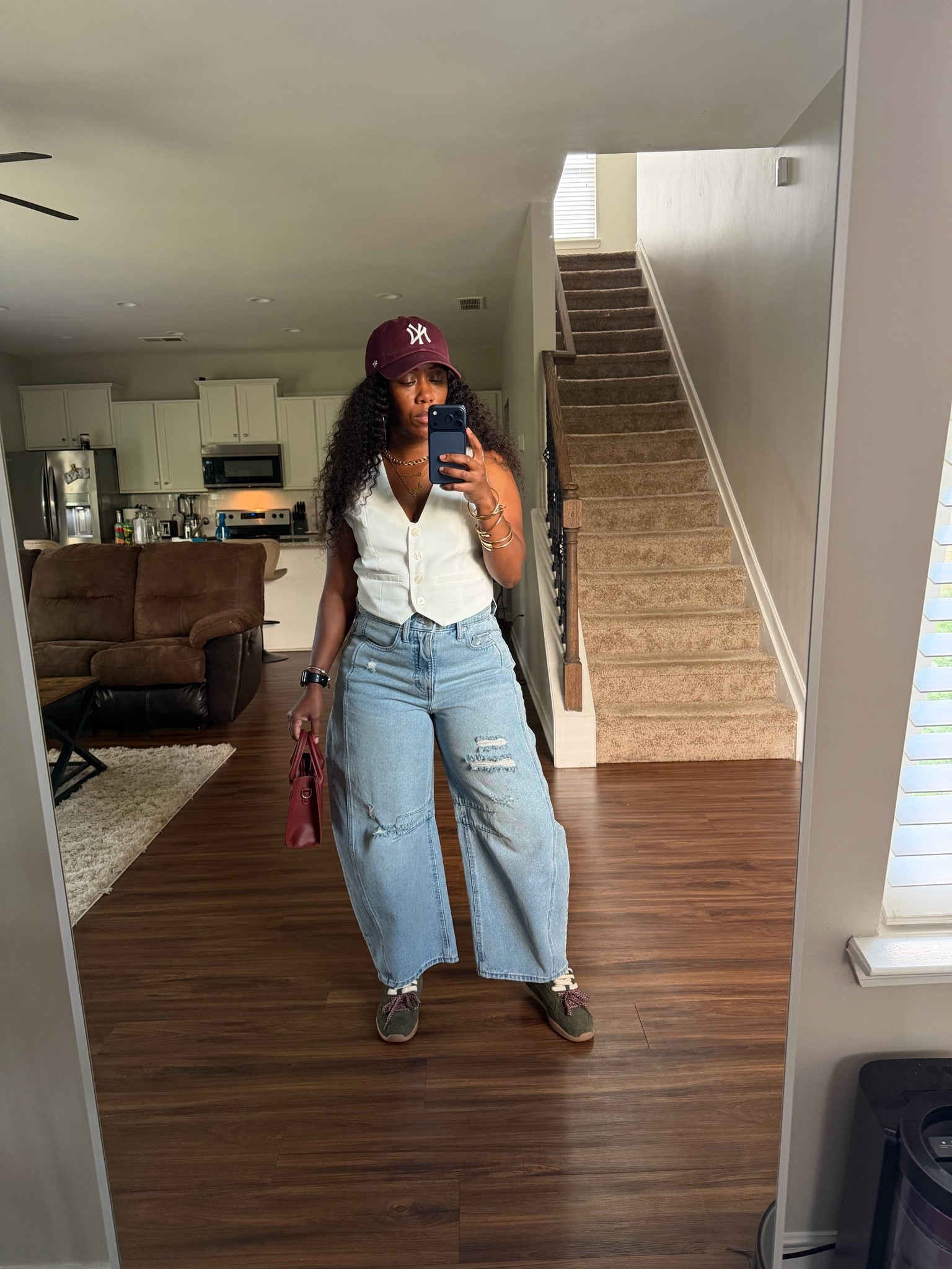 Barrel jeans and white vest casual outfit idea. I styled these barrel jeans with a white vest, burgundy NY baseball hat, burgundy purse, green faux suede double lace sneakers

#LTKootd #LTKOver40 #LTKPetite