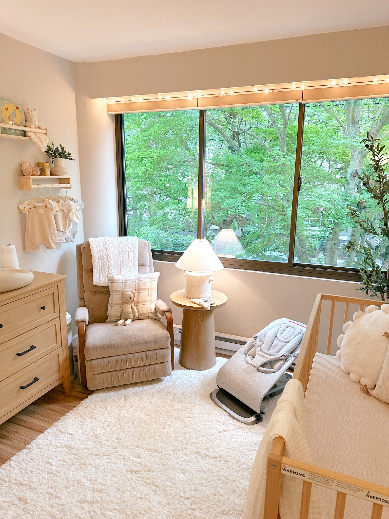 Our little apartment nursery! The crib is the IKEA Sniglar crib and we love it! #nursery #nurserydecor #nurseryreveal #babyboy #babynursery #boynursery #crib #nurserydresser #lamp #target #nurseryrug #nurseryshelves #wallshelves #changingstation 
