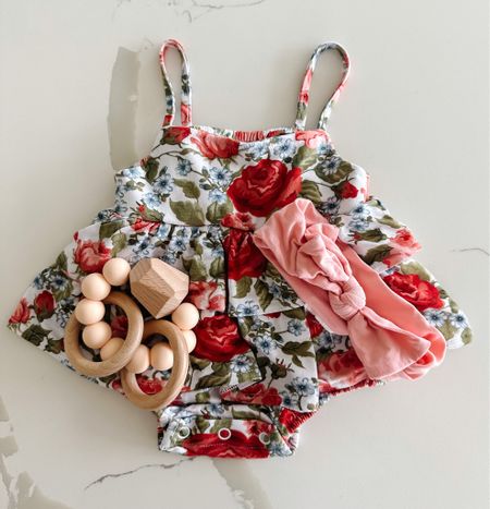 Newborn floral ruffled bubble romper paired with bow headband and toy. Absolutely love this romper for summer outfits! On sale for 25% off. Comes in a long sleeve footie, too 

#LTKSeasonal #LTKstyletip #LTKbaby
