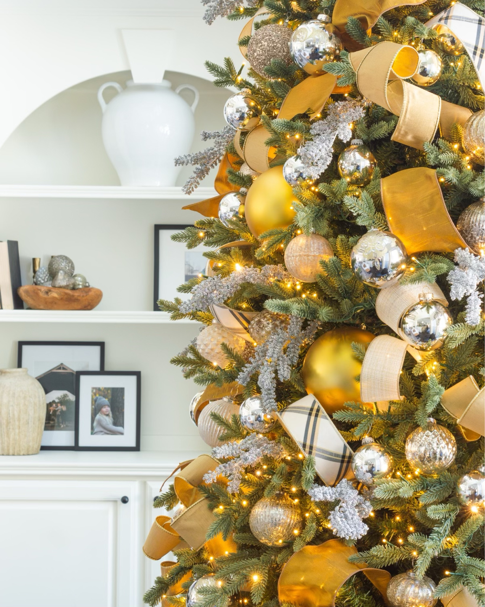 Here’s a peek back to our main Christmas tree last year, decked out in gold ribbon,silver stems and silver and gold balls. I was so happy to find 6” matte gold ornaments to provide an anchor for the rest. Gold Christmas decor silver Christmas decor gold tree silver tree Christmas tree ribbon gold ribbon decorating Christmas tree with ribbonn

#LTKHoliday #LTKHome #LTKFindsUnder50