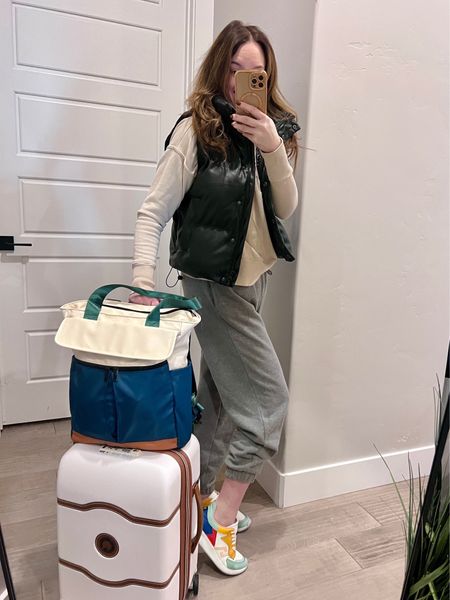 🌍✈️ Travelers, let's chat! Who says you can't look stylish and feel comfy on a long flight? 😎 For my over 40 ladies, I've got you covered with this casual yet chic travel outfit featuring my favorite @delseyparisusa luggage. 💼 I'm rocking comfy sweats, a puffer vest, and a pullover sweatshirt with my go-to sneakers so I can hustle through the airport if I need to. 🏃‍♀️ What's your go-to plane outfit? Drop a comment below and let's talk travel style! 🧳 #TravelInStyle #Over40Style #ComfortableAndCasual #PlaneOutfit #DelseyParis #RunThroughTheAirport #TravelFashion #PufferVest #SneakerStyle 🌟

#LTKunder50 #LTKstyletip #LTKtravel